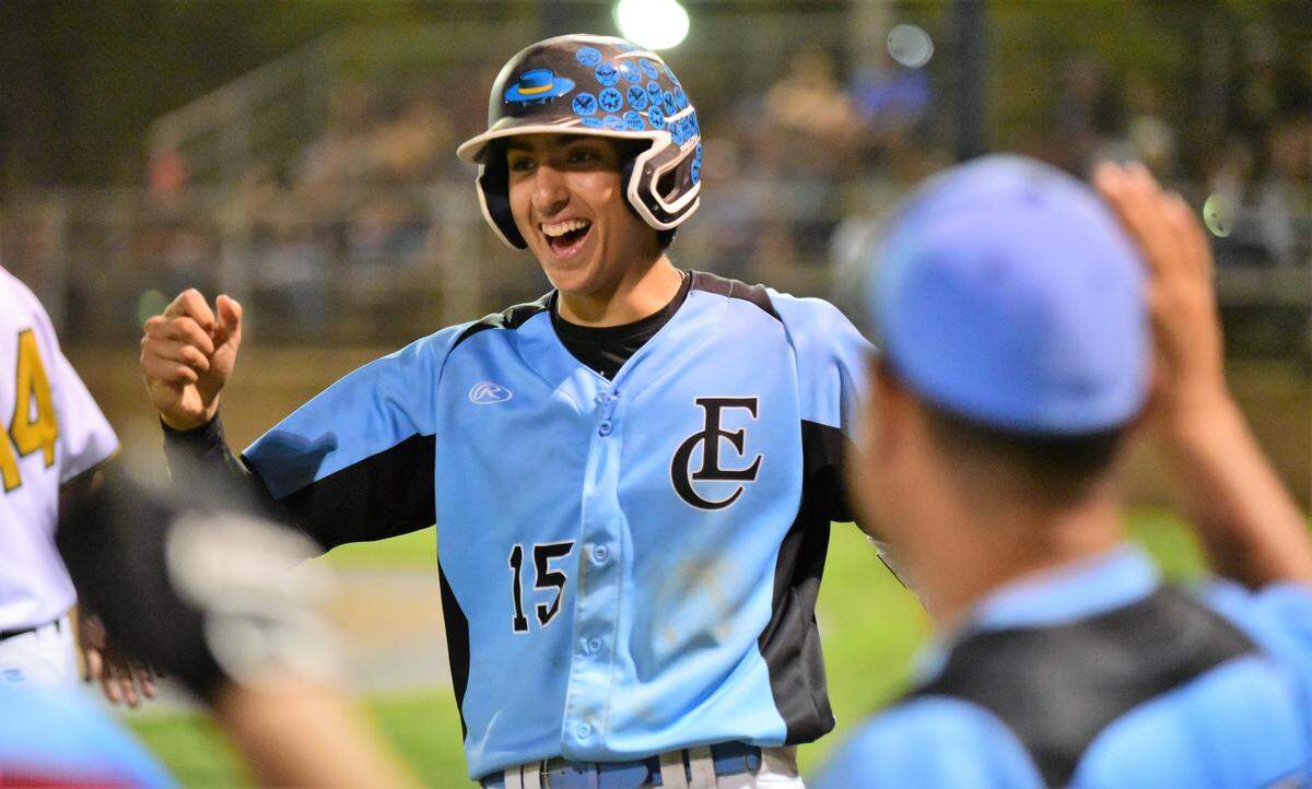 El Capitan junior Chase Minor is greeted at the South dugout after scoring a run during the 10th annual Merced County All-Star Game at Merced College. Minor had two hits and scored two runs.