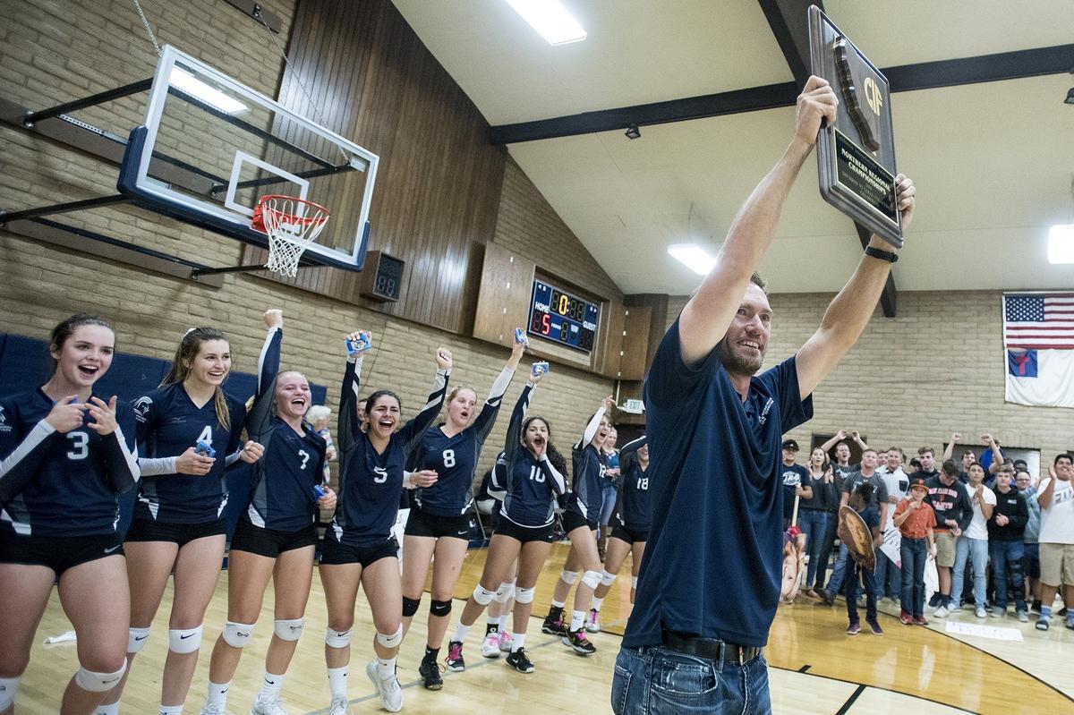 Stone Ridge Christian head coach Ken Shaw holds the CIF NorCal Division VI Regional Championship plaque after the Knights beat Forest Lake Christian 3-0 at First Baptists Merced in Merced, Calif., on Tuesday, Nov. 13, 2018.