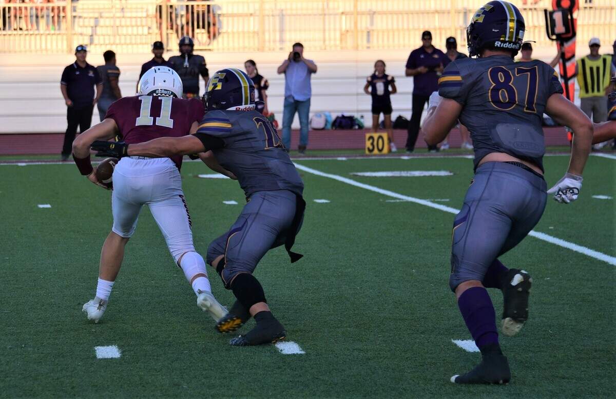 Escalon High School senior linebacker Jamin Miller sacks Golden Valley quarterback Austin Mello during a game on Friday, Aug. 18, 2023 at Veterans Stadium in Merced, Calif.