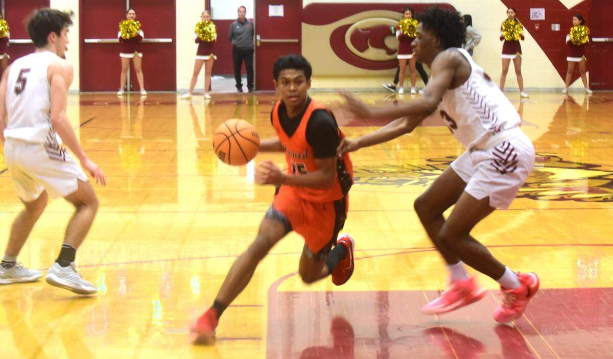 Merced High School sophomore Jordan Thomas (15) drives to the basket during a game against Golden Valley on Wednesday, Jan. 3, 2023 at Cougar Arena.