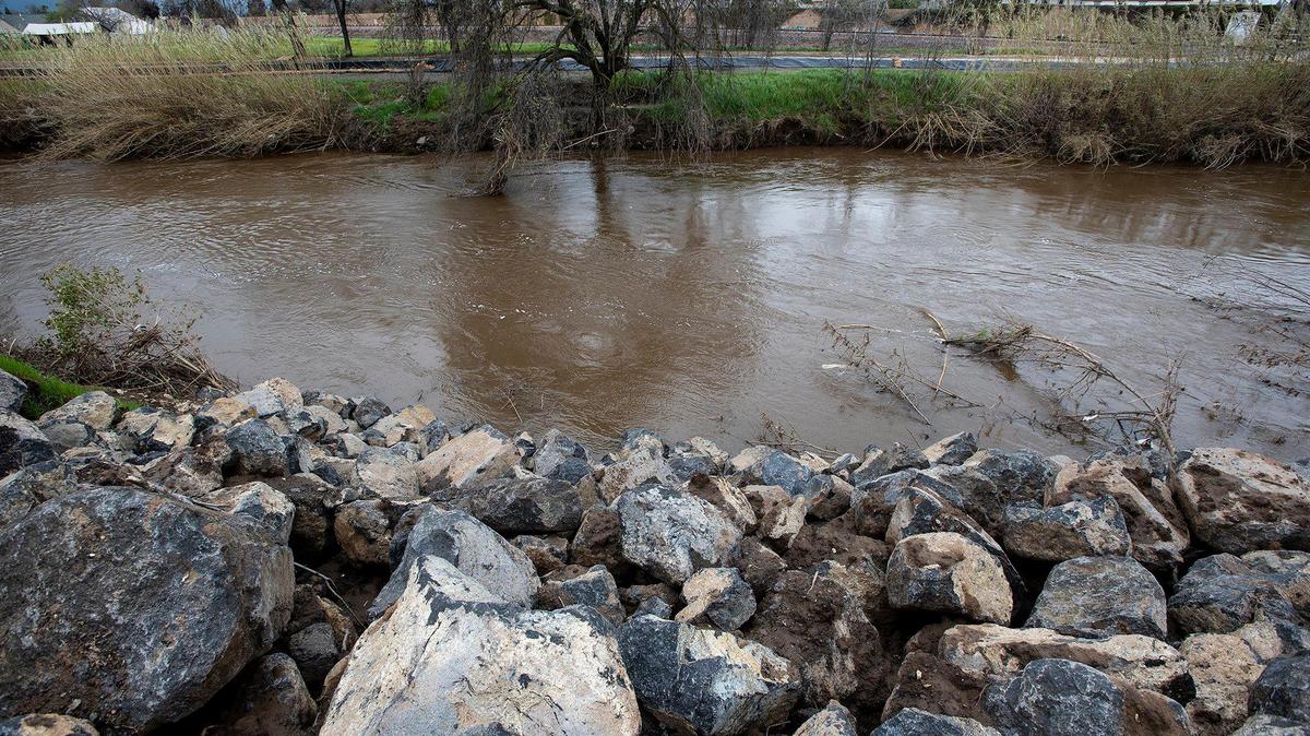A reinforced section of creek bank along Bear Creek near West 23rd Street in Merced, Calif., is pictured on Tuesday, March 14, 2023.