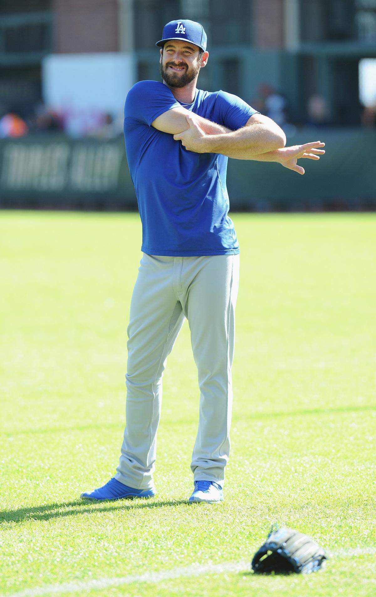 Los Angeles Dodgers relief pitcher Dylan Floro stretches before a game against the San Francisco Giants at AT&T Park in San Francisco near the end of the regular season. 