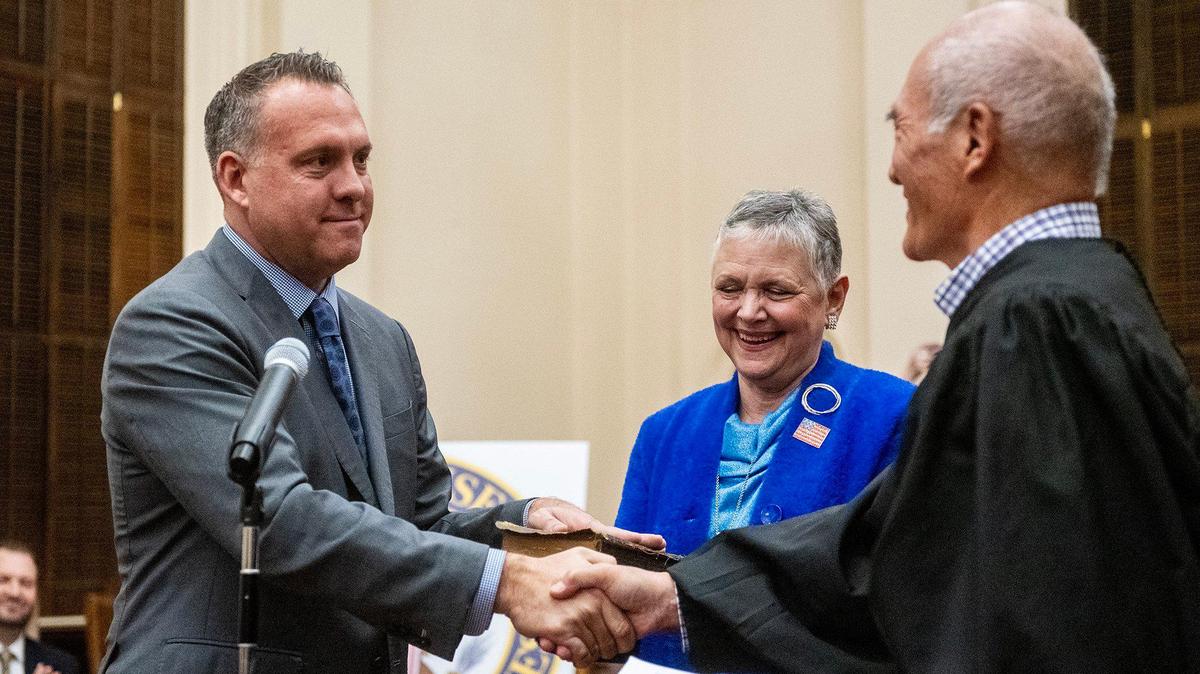Rep. Adam Gray, left, takes the ceremonial oath of office administered by Merced County Superior Court Judge John Kirihara, right, while Gray is joined by his mother Candice Adam-Medefind during a ceremony on Jan. 30. Gray was officially sworn in as a member of the 119th Congress on Jan. 3.