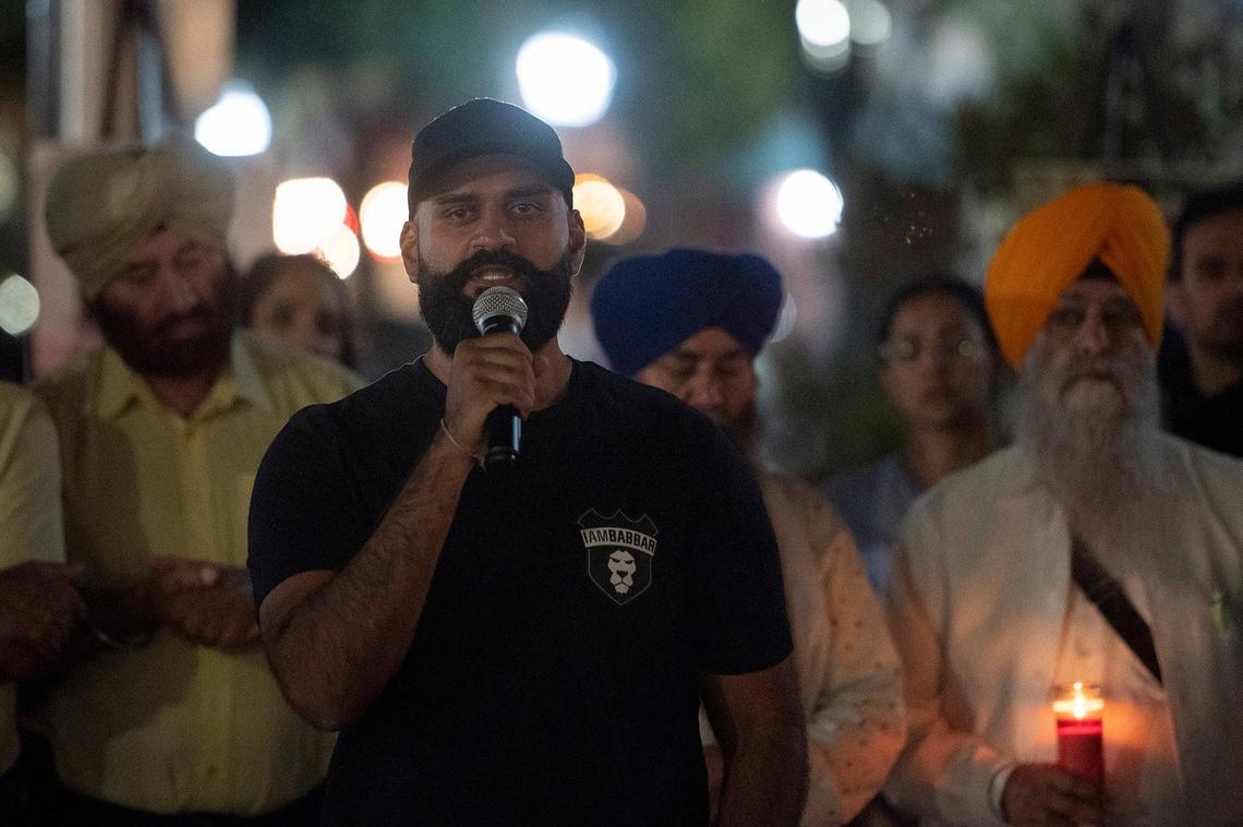 Sukhdeep Bhela, a cousin of Jasdeep Singh, 36, and Amandeep, Singh, 39, speaks during a vigil for his cousins, 8-month-old Aroohi Dheri and her mother, Jasleen Kaur, 27, at Bob Hart Square in Merced, Calif., on Sunday, Oct. 9, 2022. All four kidnapping victims were found dead in a rural area of Merced County north of Dos Palos on Oct. 5. Authorities said the family was kidnapped at gunpoint from a Merced County business on Oct. 3.