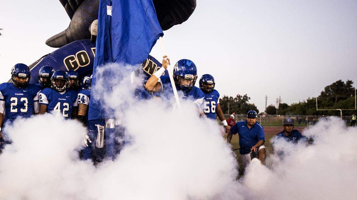 The Atwater Falcons take the field during a game against Patterson at Atwater High School in Atwater, Calif., Friday, Sept. 18, 2015. The Tigers beat the Falcons 37-10.