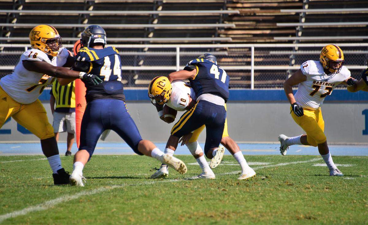 Merced College linebacker Chris Munoz sacks Hartnell College quarterback Isaiah Ariolla-Randalle during a game on Saturday, Oct. 26, 2019 at Stadium ’76.