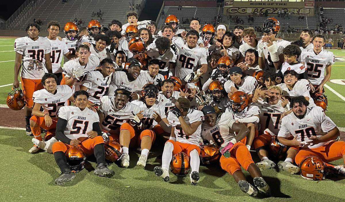 The Merced High football team poses for a team photo with the Mayor’s Cup trophy after defeating Golden Valley 32-8 for the Bears’ 19th consecutive victory over the Cougars on Friday, Oct. 4, 2024.