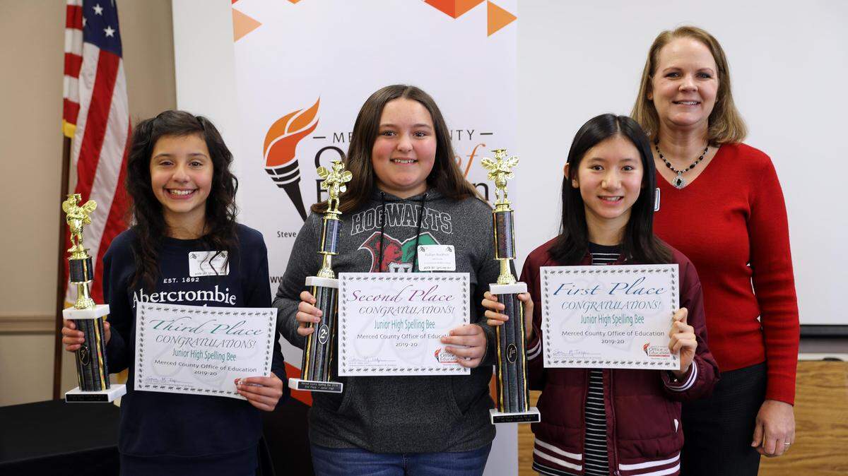 Stacy Shasky, Coordinator of the Teacher Induction Programs at the Merced County Office of Education, was the wordmaster for the Merced County Junior High Spelling Bee, poses with the top three winners, from left: third place winner Mariah Dhillon, a seventh grader at Winton Middle School; second place winner Kaitlyn Rockholt, an eighth grader at Cruickshank Middle School in Merced; and first place winner Nicole Nguyen, an eighth grader at Cruickshank Middle School.