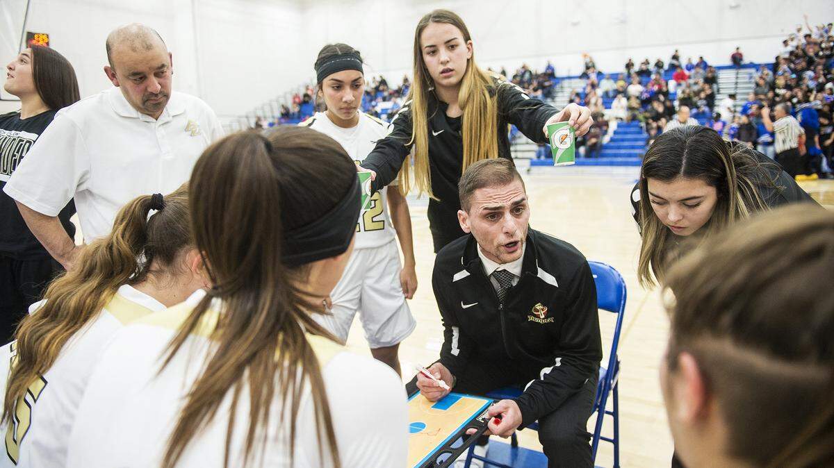 Buhach Colony coach Kevin Aguia speaks to his players during a game against Atwater at Atwater High School in Atwater, Calif., on Thursday, Jan. 17, 2019.