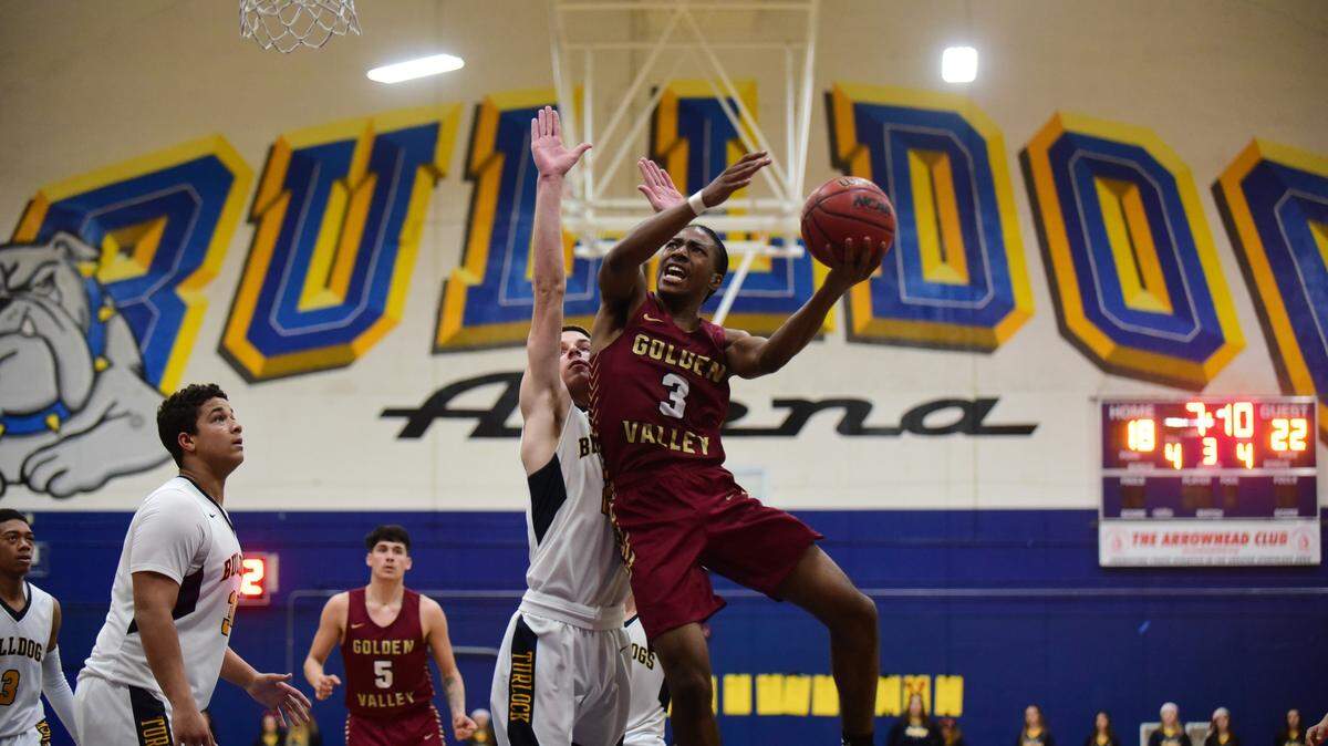 Golden Valley senior Aurrion Harris goes up for layp against Turlock during the championship game of the Godinez Tournament at Turlock High. Harris was named the tournament MVP after leading the Cougars to a 52-36 win.
