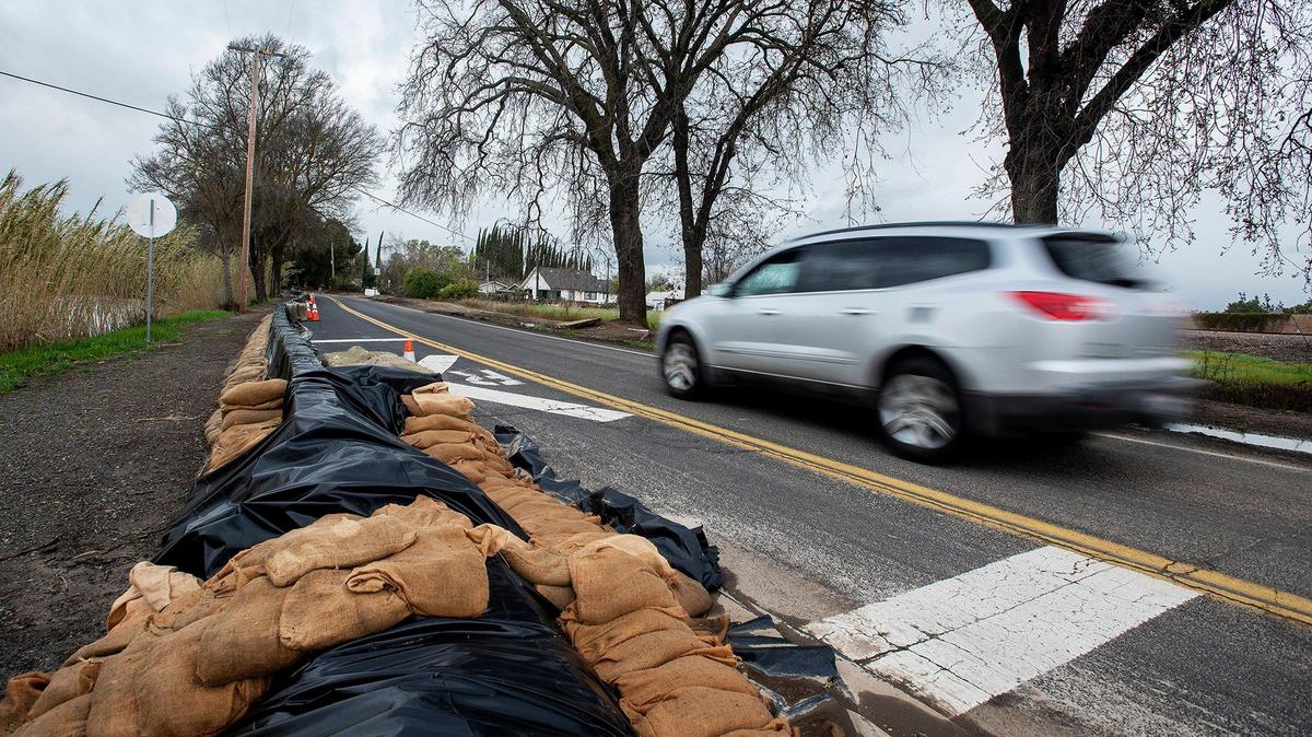 Sandbags line West North Bear Creek Drive in Merced, Calif., on Tuesday, March 14, 2023.