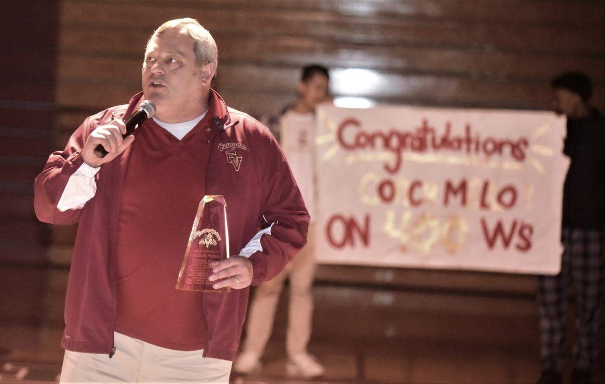 Golden Valley High School wrestling coach Chopper Mello speaks during a ceremony honoring Mello for his 400th career win prior to a match against Patterson on Tuesday, Jan. 17, 2023 at Golden Valley High School.
