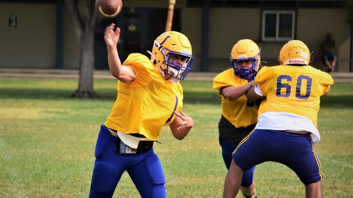 Dos Palos senior quarterback Trent Calvert throws a pass during practice on Saturday, Oct. 8, 2021.