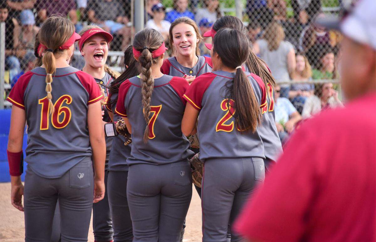 The Golden Valley High softball team celebrates a 2-0 win over Atwater on Monday, May 6, 2019 at Atwater High in Atwater, Calif.