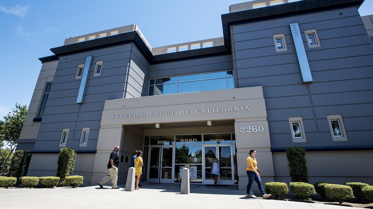People enter and exit the Merced County Superior Courthouse located at 2260 N Street in Merced, Calif., on Wednesday, July 25, 2018. 