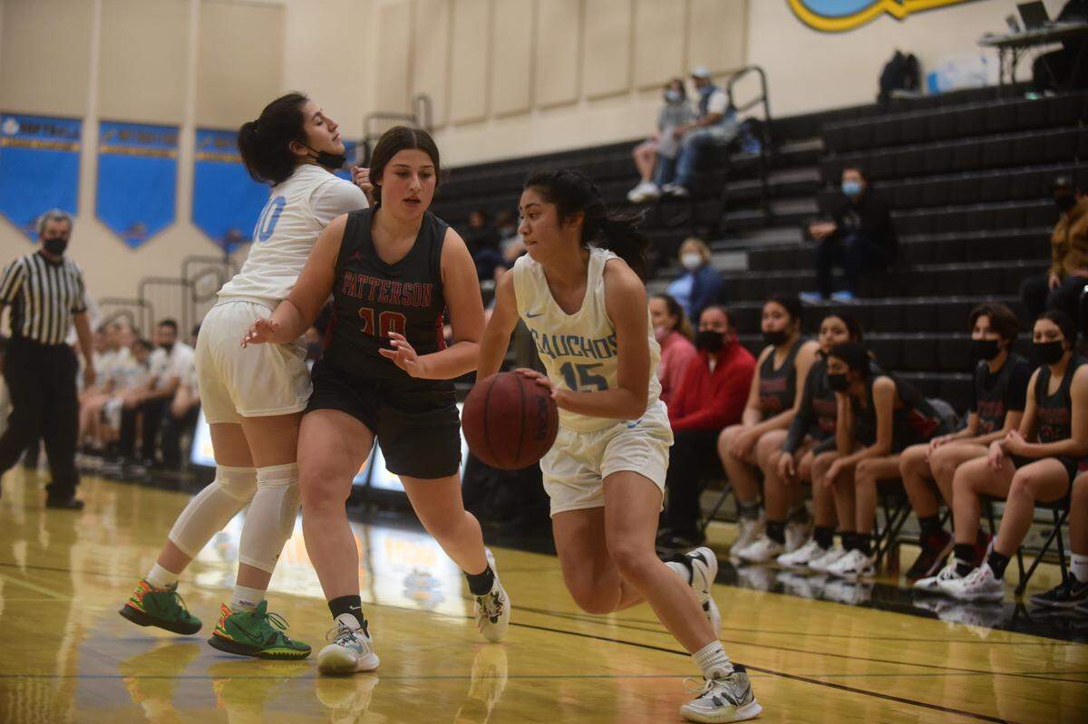 El Capitan High senior Keira Flores drives the basketball in a game against Patterson on Tuesday, Jan. 11, 2022 at El Capitan High School in Merced, Calif.