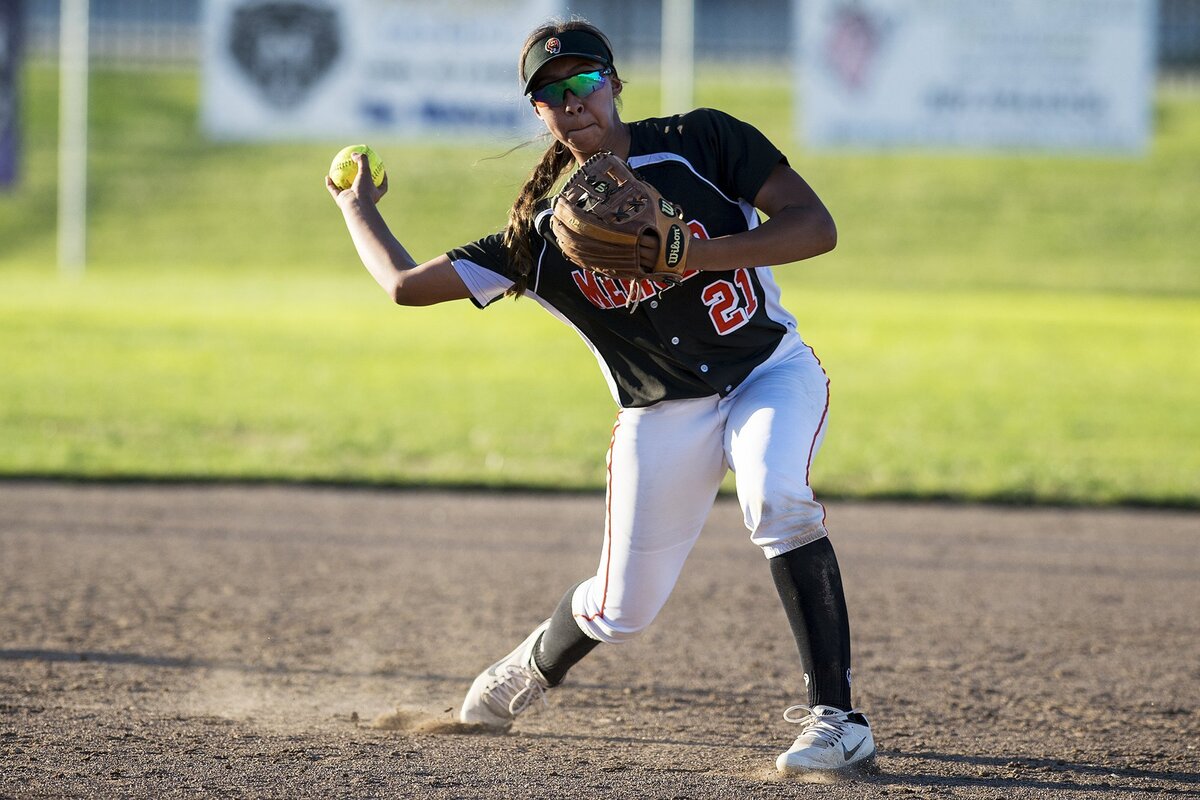 Merced's Jewels Perez (21) throws to first base for an out during the annual Paul Leonardo Memorial All-Star Game at Livingston High School in Livingston, Calif., on Tuesday, June 12, 2018.