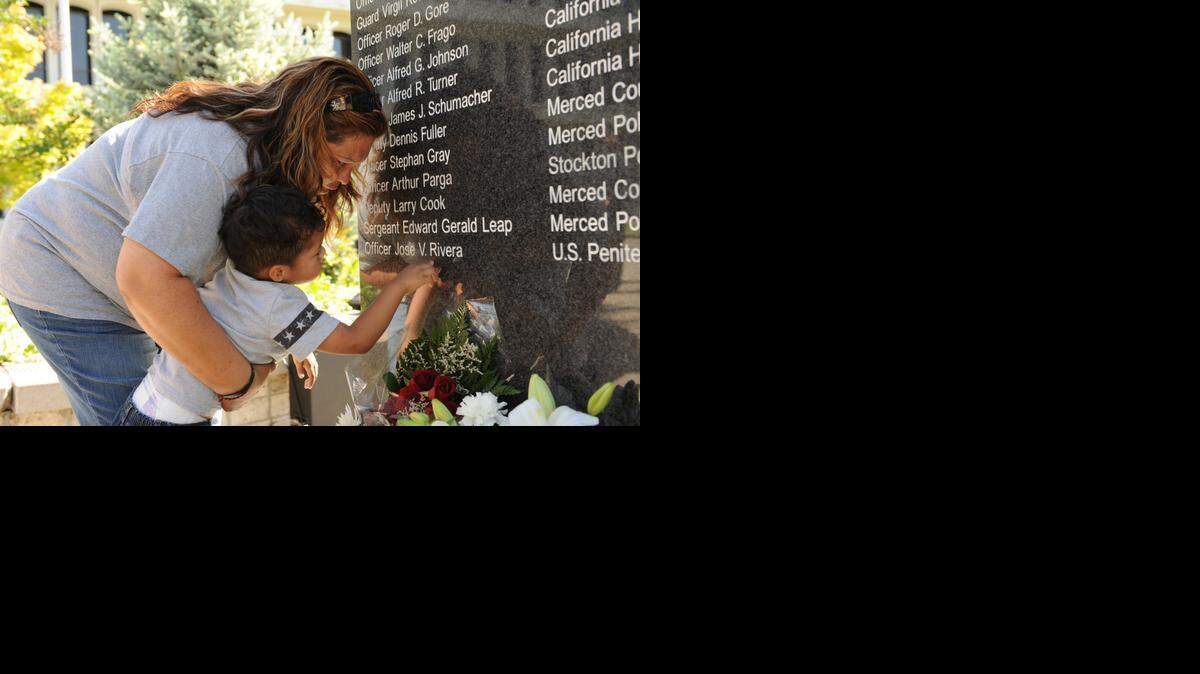 Terry Rivera is angry about the plea deal with James Ninete Leon Guerrero, saying it amounts to “slapping him on the hand.” She and her grandson Matthew Contreras stands at a memorial on which son Jose Rivera’s name is engraved.