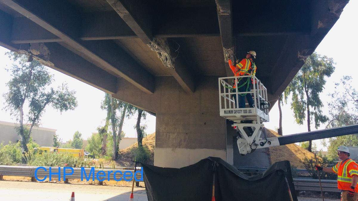 Caltrans crews repair the Highway 99 Applegate Road overpass after a big rig reportedly collided with the bridge the morning of Thursday, Oct. 11, 2018, according to California Highway Patrol.