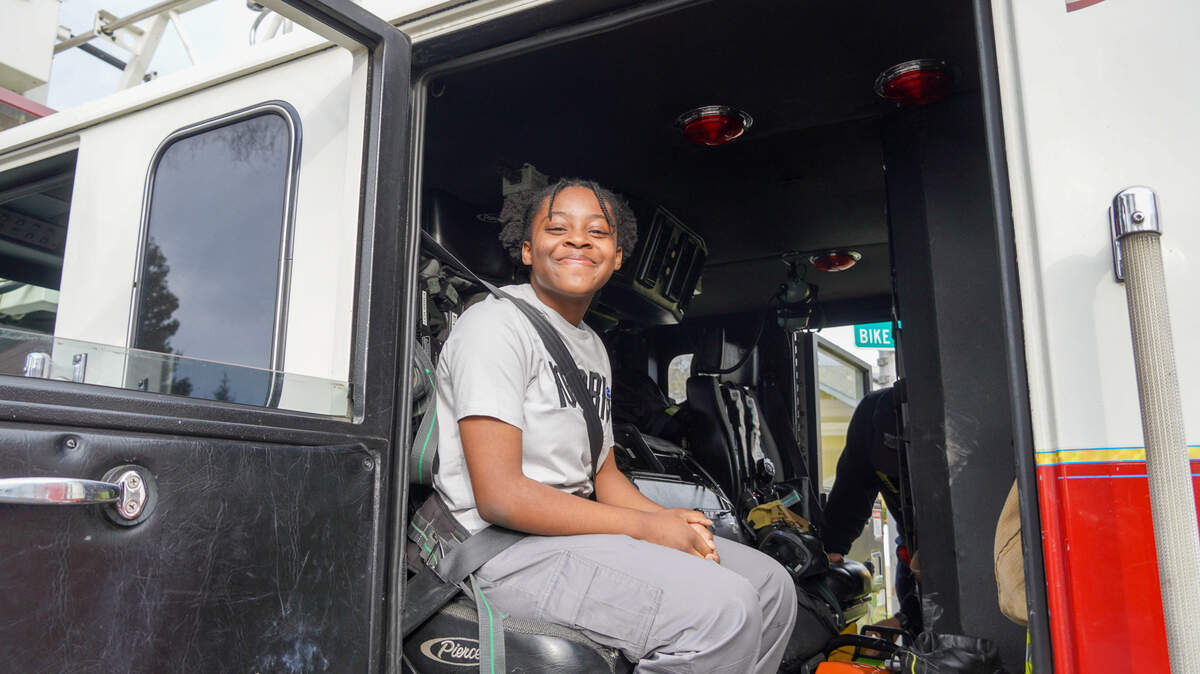 Hoover Middle School student Lailah Brooks, 13, took a ride in a fire engine after firefighters from the Merced City Fire Department made a surprise visit to the school on Friday, March 14, 2025 after Brooks expressed her aspirations of becoming the first Black fire chief for the department.