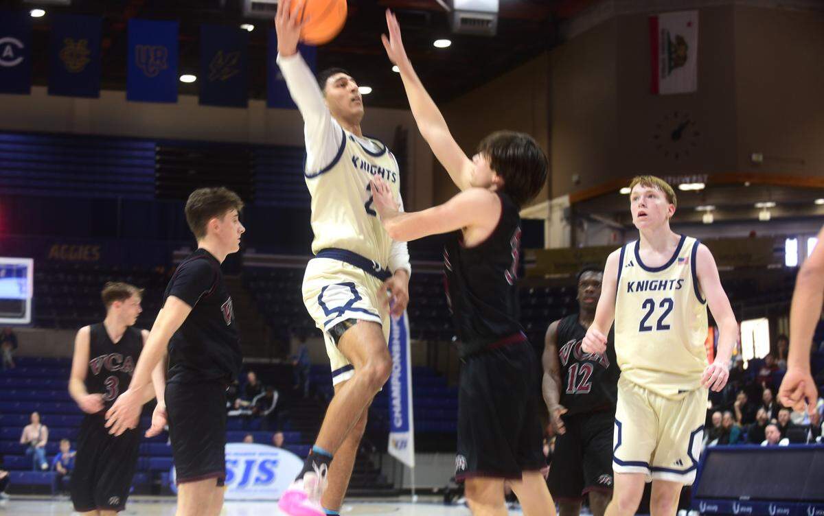 Stone Ridge Chrisitan senior Brock Richards (21) drives to the basket during the section championship game against Valley Christian at UC Davis on Friday, Feb. 23, 2024.