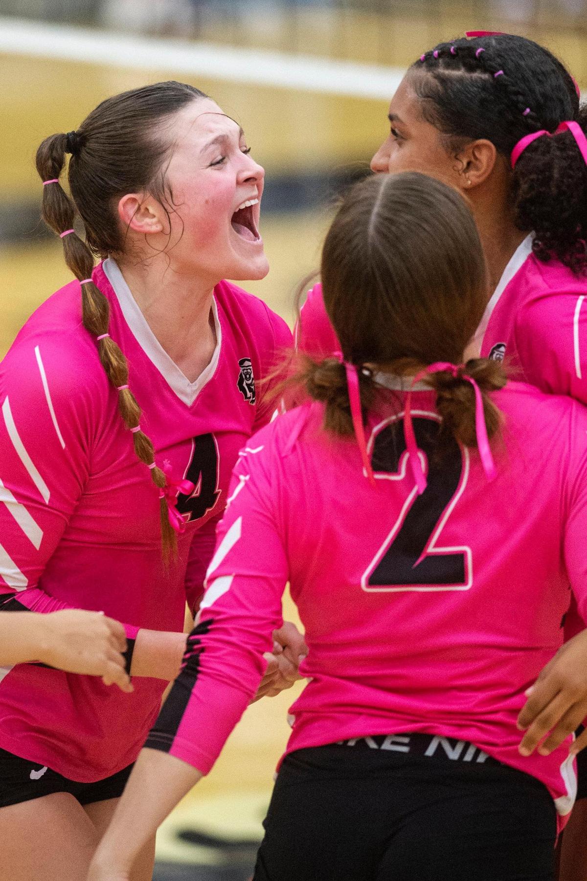 Merced’s Sydney Perez (4), Lily Meneley (2) and Averie Steverson (10) celebrate a point during a match against El Capitan at Merced High School in Merced, Calif., on Wednesday, Oct. 4, 2023. The Gauchos swept the Bears 3-0.