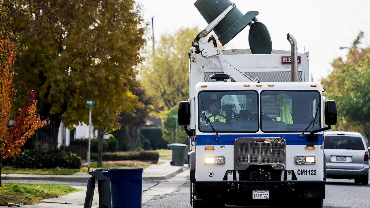 A City of Merced truck is shown collecting green waste in Merced Calif., Tuesday, Dec. 8, 2015.