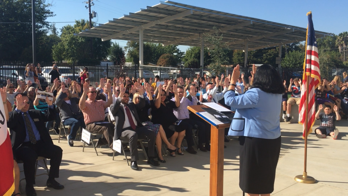 MCSD Superintendent Dr. RoseMary Parga Duran leads the audience in a celebratory activity during the STEAM Center dedication ceremony on Wednesday Oct. 25, 2017.
