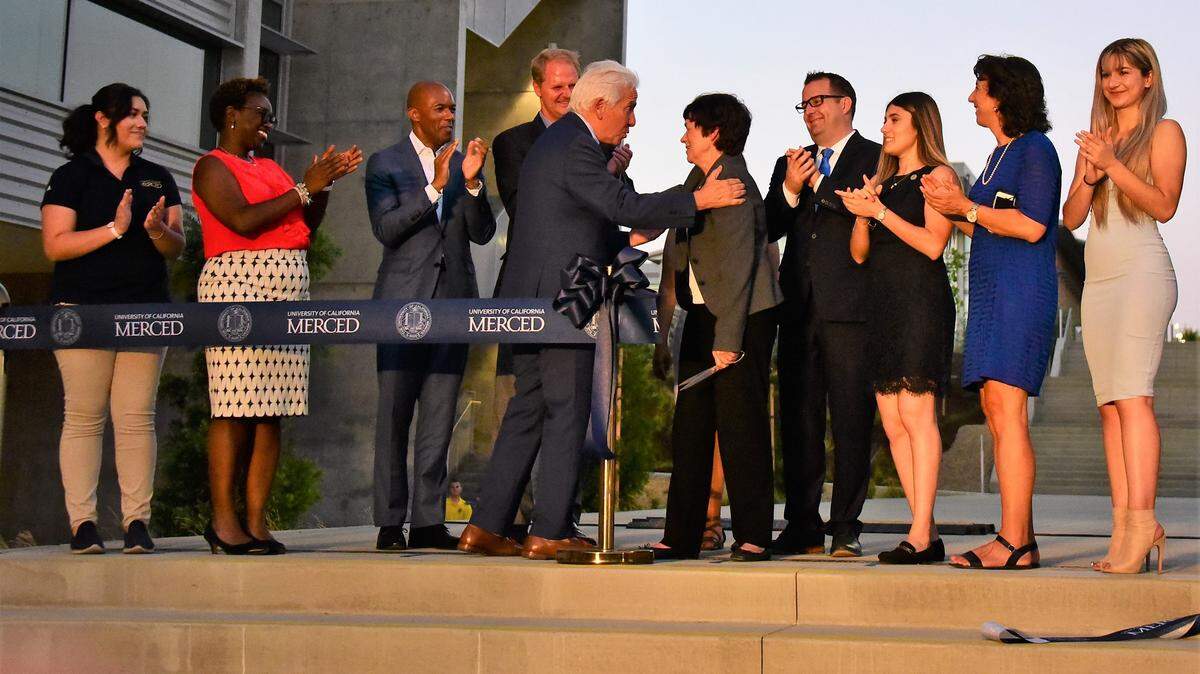 Rep. Jim Costa congratulates outgoing UC Merced chancellor Dorothy Leland during a celebration at the university on Wednesday, Aug. 14, 2019. UC Merced unveiled two new research buildings as part of their 2020 project.