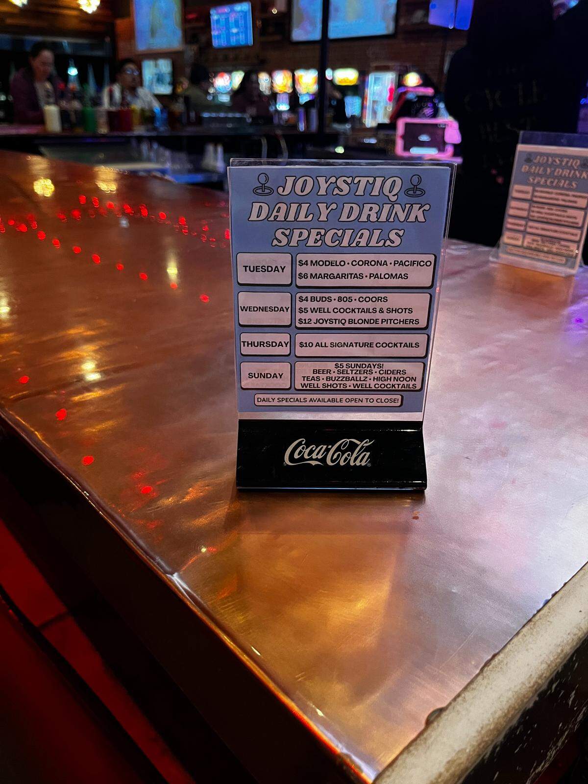 Joystiq Daily Drink specials list in white text on a blue background