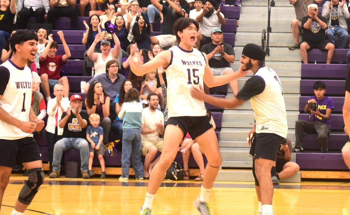 Livingston High’s Bradley Kaji (15) celebrates with teammate Udayveer Dhadda (right) after scoring a point during the Wolves’ 3-1 victory over Oakland High in the Northern California Division IV boys volleyball final on Saturday, May 24, 2025 at Livingston High School.