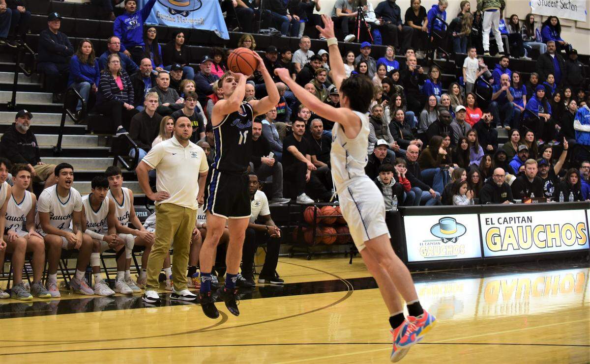 Atwater High senior Tyler Parr (10) goes up for a shot as El Capitan senior Brody Collins (3) contests during a game on Friday, Jan. 13, 2023 at El Capitan High School.