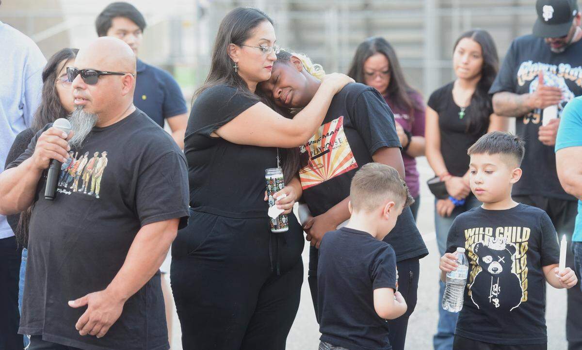 Oscar Rodriguez speaks during a candlelight vigil held at Golden Valley High School in Merced, Calif. on Friday, Aug. 2, 2024 for his son Oscar Xavier Rodriguez while other family members look on. Rodriguez, 15, was struck and killed by a vehicle while riding his bike home on July 25, 2024.