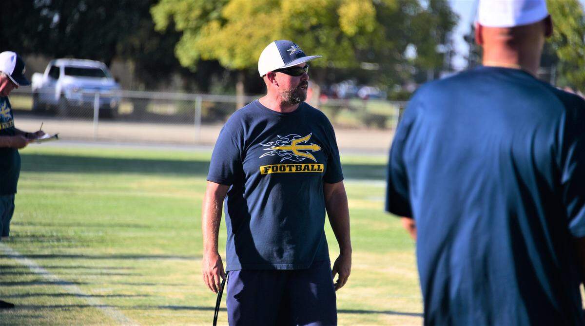 Merced College first-year head coach Justin Pinasco walks the sideline during a scrimmage against Fresno City at Stadium ’76 on Thursday, Aug. 25, 2022.