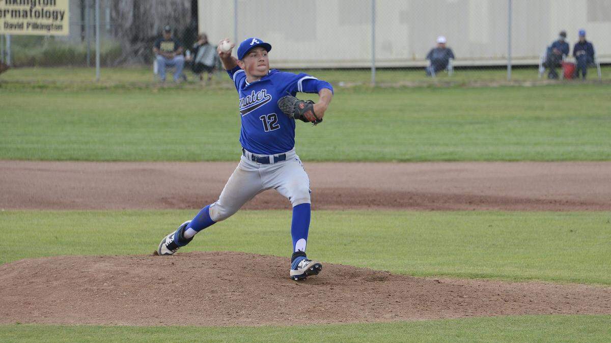 Atwater junior pitcher Nathaniel Silva (12) delivers a pitch during a game against Buhach Colony at Buhach Colony High School in Atwater, Calif., on Tuesday, April 2, 2019. 