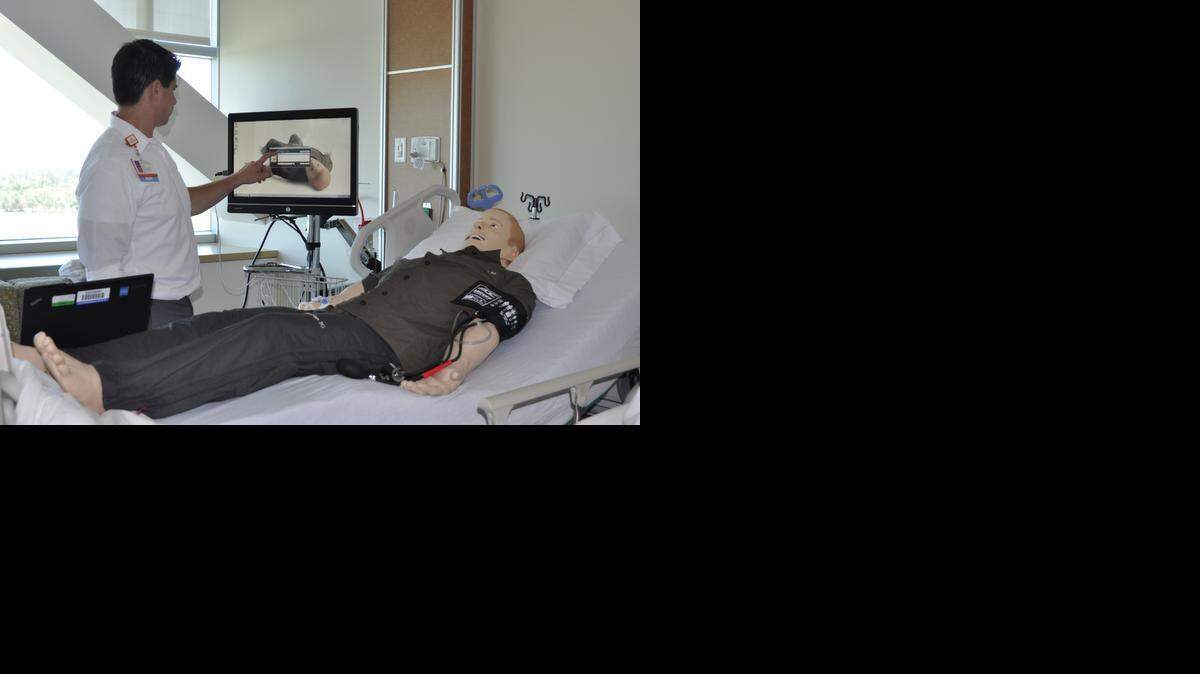 Jose Soto, a general educator at Mercy Medical Center Merced operates ‘David,’ a simulation mankin used for in-house training of medical staff. 

