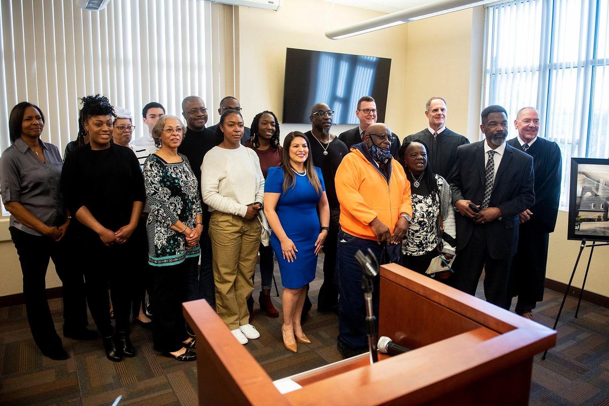 People gather for photos following a ceremony celebrating the naming of Merced County’s main courthouse after Professor Charles James Ogletree Jr., in Merced, Calif., on Friday, Feb. 17, 2023. The naming of the building comes after the signing of Assembly Bill 2268 by Gov. Gavin Newsom, recognizing Ogletree’s contributions to law, education and civil rights.