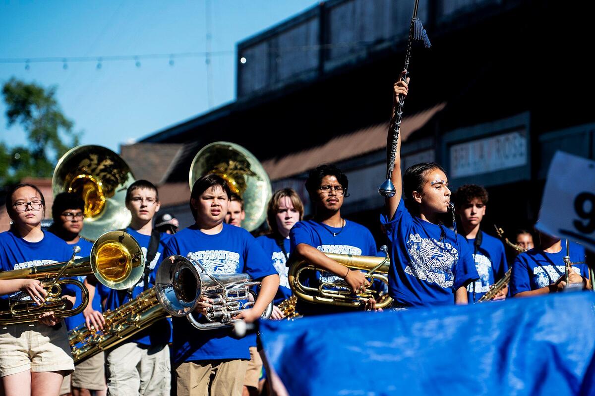 A band is led down Broadway Avenue by its drum major during a Fourth of July parade in Atwater, Calif., on Monday, July 4, 2022.