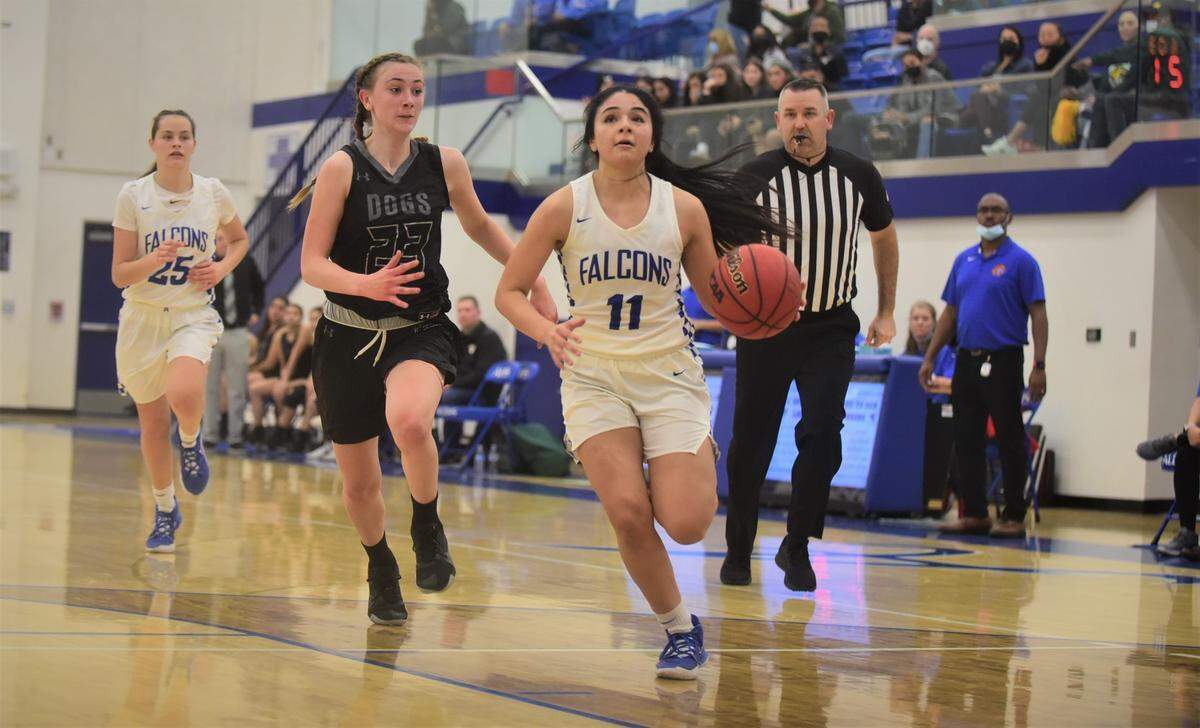 Atwater High senior Aliene Lopez (11) looks to score on a fast break against Tracy during a playoff game on Thursday, Feb. 17, 2022 at Atwater High School.