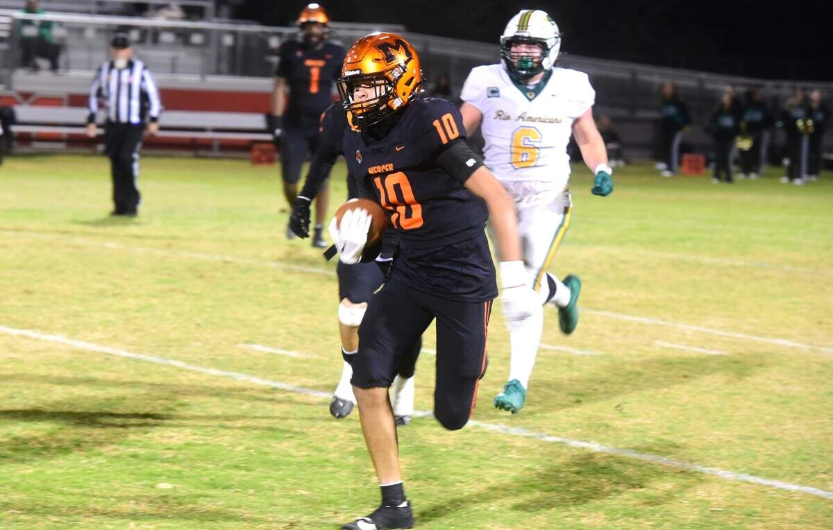 Merced High senior safety Antonio Aaron (10) returns an interception during a playoff game against Rio Americano on Friday, Nov. 8, 2024 at Cathie Hostetler Stadium in Merced, Calif.