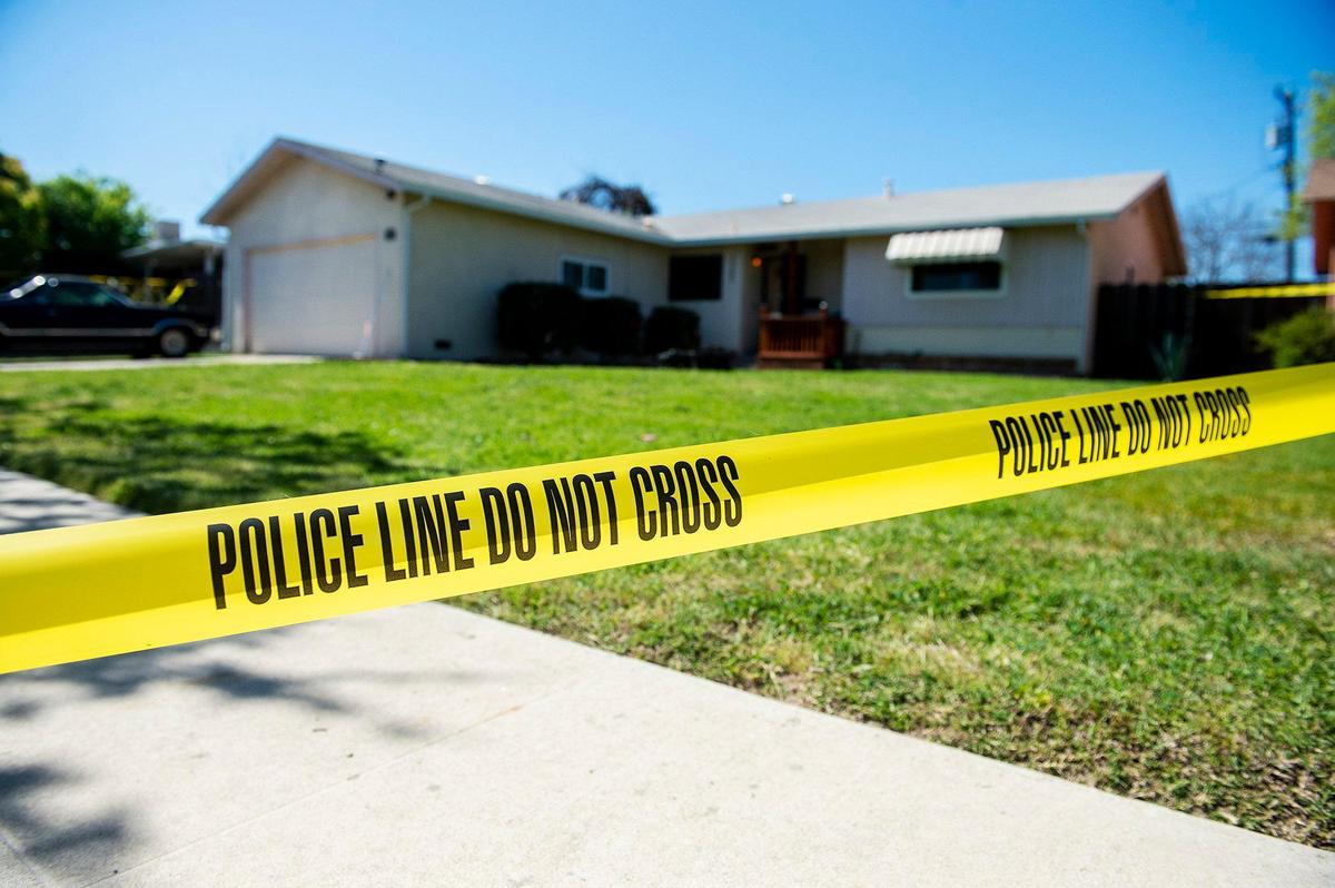 Atwater Police investigate a home in the 2200 Block of Eucalyptus Street in Atwater, Calif., on Wednesday, April 1, 2020. According to Atwater Police, two suspects were arrested Wednesday morning in connection with a homicide investigation after a woman was found dead in a vehicle near Ralston Park on March 22.