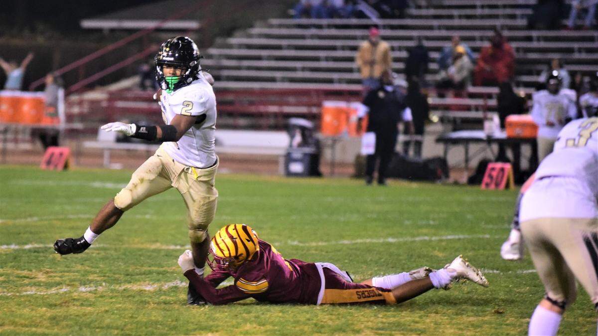 Buhach Colony senior Jaxson Percoats runs out of the grasp of a Los Banos defender during the Thunder’s 64-48 playoff victory on Friday, Nov. 4, 2022 at Loftin Stadium in Los Banos, Calif.