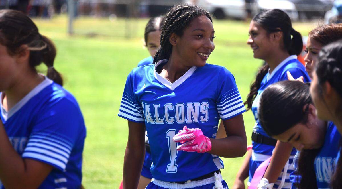 Atwater High receiver Jordin McDowell (1) is congratulated by teammates after scoring a touchdown during a flag football game against Tokay on Saturday, Aug. 24, 2024 at Merced High School.