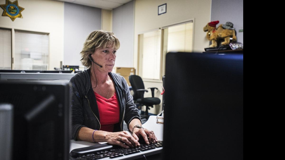 
Public safety dispatcher Stacy Fister-Walley of Delhi fields 911 calls at the Merced-area California Highway Patrol office in Atwater on Wednesday. Many Merced County residents calling 911 Wednesday morning from cellphones had their calls rerouted to various emergency dispatch centers in the Valley.
