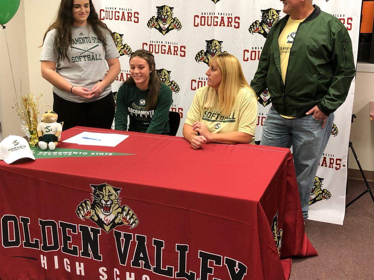 Golden Valley senior Marissa Bertuccio signed her national letter of intent on Wednesday to accept a scholarship to Sacramento State. Bertuccio was joined by her sister Brianna (left), and parents Jennifer and Mike in the Golden Valley High library.
