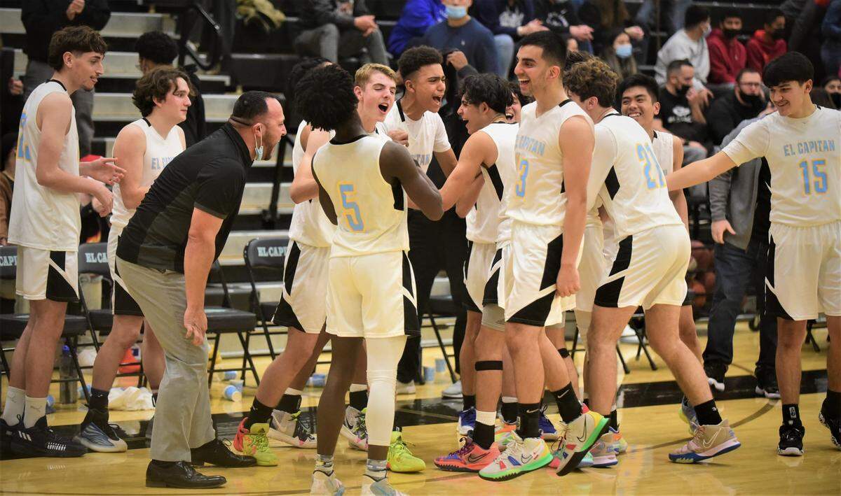The El Capitan High basketball team celebrates a 64-52 win over Atwater after the final buzzer sounds at the Stable Center on Friday, Jan. 14, 2022 at El Capitan High School in Merced, Calif.