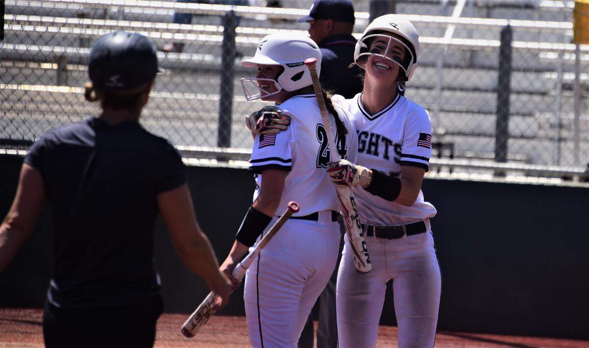 Stone Ridge Christian senior Caitlyn Cole hugs teammate Alyssa Villa after scoring a run during the Sac-Joaquin Section Division VII championship game against Big Valley Christian on Saturday, May 21, 2022 at the San Joaquin Delta Softball Complex in Stockton, Calif.