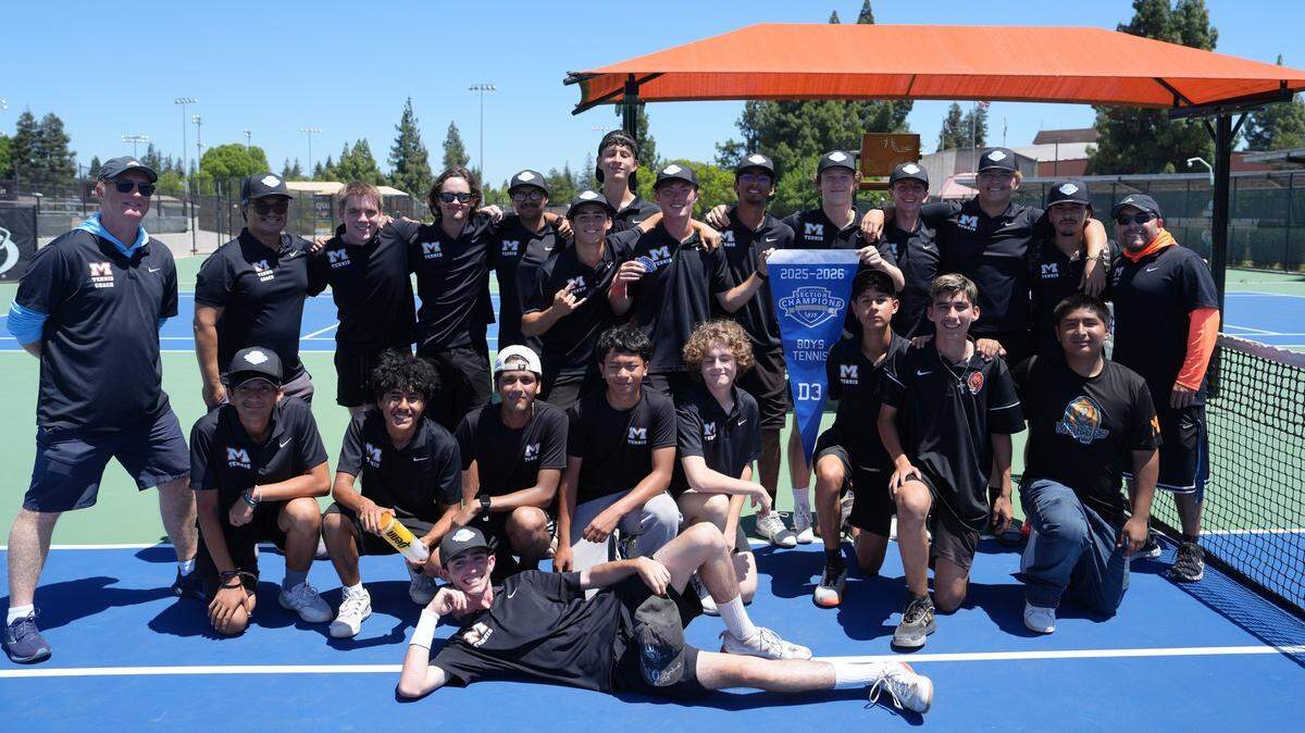 The Merced High tennis team celebrates with the Sac-Joaquin Section Division 3 blue banner on Thursday, May 14, 2026.