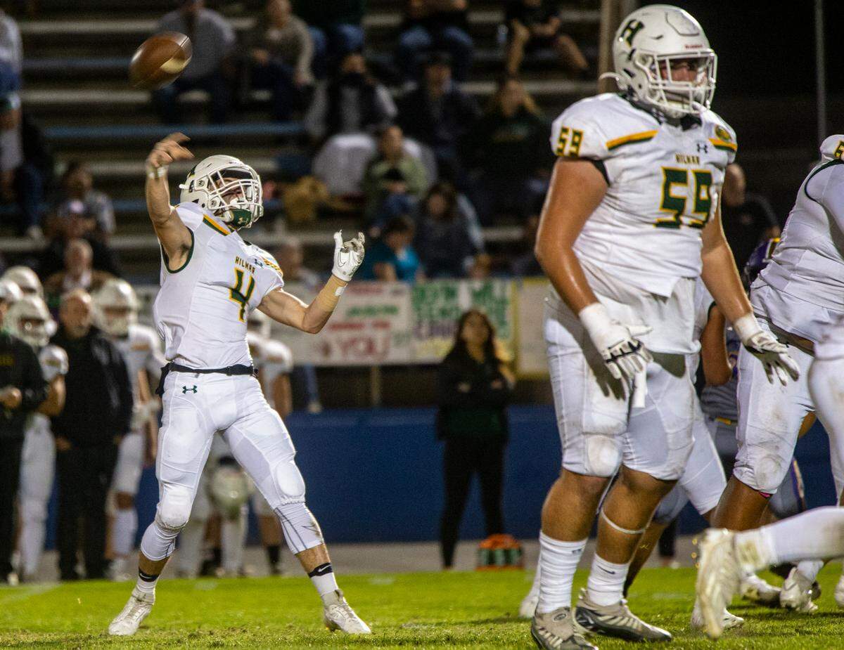 Merek Ellerd, 4, of Hilmar High throws a pass up field during play against Escalon High Friday Oct. 13, 2023 at Modesto Jr. College.