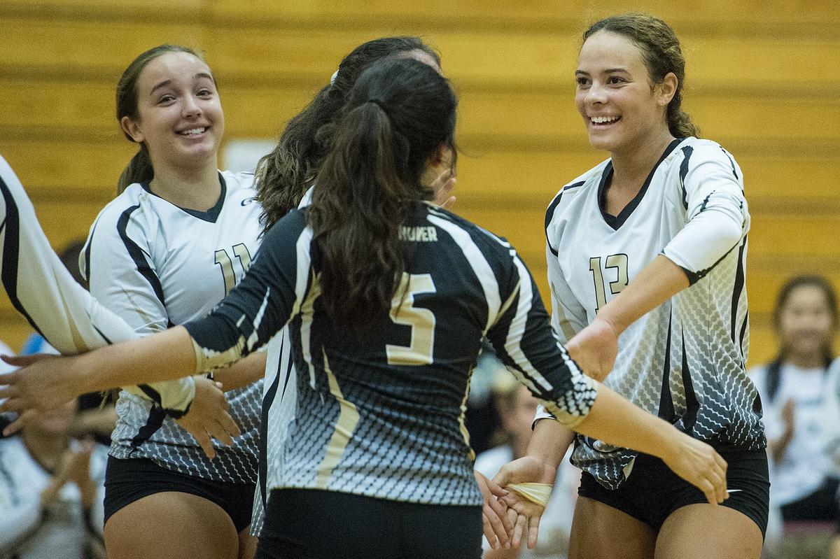 Buhach Colony senior Cameron Gray (13) celebrates a Thunder point with teammates during a match against Golden Valley at Golden Valley High School in Merced, Calif., on Wednesday, Sept. 5, 2018. The Thunder beat the Cougars 3-0.